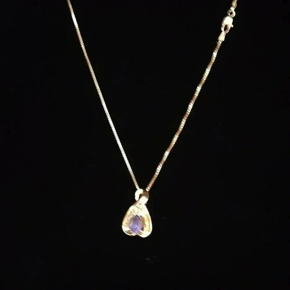 Stunning 14 karat gold and tanzanite diamond pendant